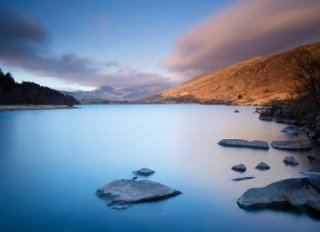 Stunning views across a still lake in Wales